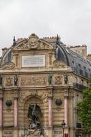 beautiful Saint Michel fountain in Paris photo