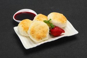 Curd pancakes with jam and stravberry photo