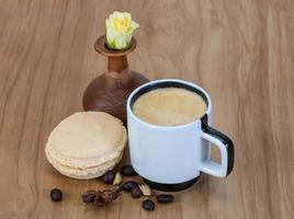 Coffee with macaroons and rose photo