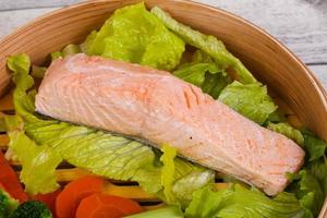 Steamed salmon with vegetables photo