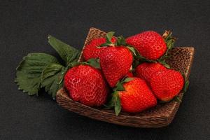 Ripe sweet strawberry with leaf photo