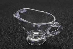 Empty glass gravy boat photo