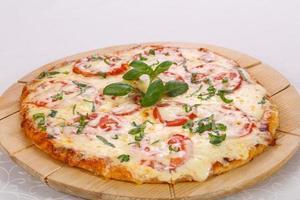 Pizza with tomato and cheese photo