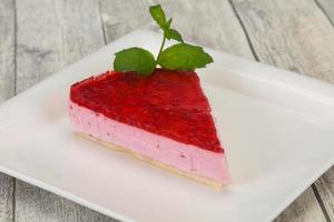 Soft Raspberry cheesecake served mint photo