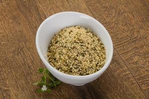 Peeled hemp seeds in the bowl photo