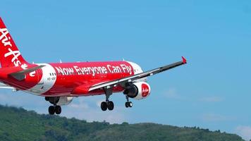 PHUKET, THAILAND   DECEMBER 2, 2018 - AirAsia Airbus 320 HS ABF approaching and landing at Phuket airport. video