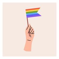 una mano sostiene una bandera lgbt. mes del orgullo, bandera lgbt, arcoiris. ilustración vectorial plana vector