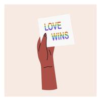 Hand holding an LGBT poster love wins. Pride month, LGBT flag, rainbow. Flat vector illustration