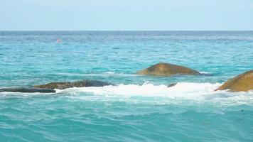 Turquoise waves rolled on the rocks, beach of Koh Miang island, Similan Islands, slow motion video