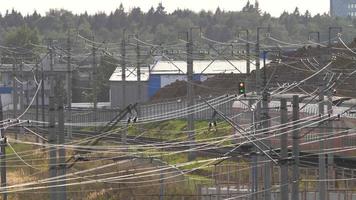 Double decker commuter trains pass railway station. Modern double decker train rides of Airport. video