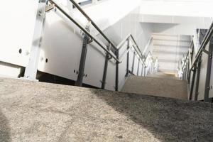 public staircase at station or mall for exit, entrance. stair inside the metro subway with cleanly steel handrail. An empty staircase at a metro station photo