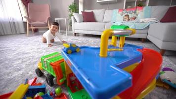 Crawling baby. Baby crawls and moves on her bottom to toys. This is a Slow motion video.