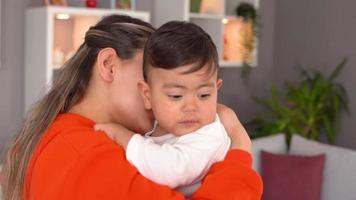 Mother baby sniffing. The mother sniffs and hugs her baby. He rubs his back. This is a Slow motion video. video