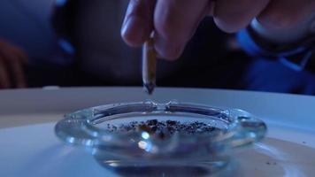 Extinguishing a cigarette in the ashtray. Extinguishing a close-up cigarette in an ashtray. video