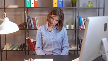 Desk exercises. Still life. Health work. While sitting on the chair, move your head from left to right in an oval 5 times. video