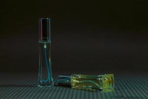 Perfume bottle on the table, black background photo