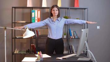 Desk exercises. Still life. Health work. Raise the hands back to the sides 5 times. video