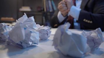 Office worker crumpling paper. Office worker or businessman examining and crumpling documents. video