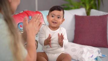 Baby clap and laugh. Fun, cute and happy images of baby clapping with his mother. This is a Slow motion video.