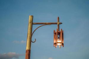 vintage old lamp at dusk, Sunset lamp, blue sky photo