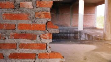 Close-up of the rubble of an industrial building collapsing into a pile of concrete and brick. and the jagged debris caused by the failure of the engineers at the abandoned construction. photo