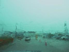 Blurred image in front of car windshield when it rains photo