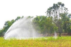 Agricultural irrigation systems that are watering the farm on a white background photo