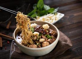 Noodles with pork and pork balls with soup Thai style photo