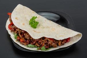 Burrito with minced meat and beans photo