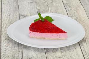 Soft Raspberry cheesecake served mint photo