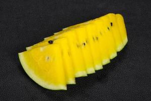 Sliced sweet tasty yellow watermelon photo