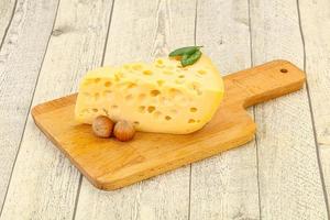 Maasdam cheese - yellow triangle with holes photo