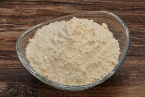 Wheat flour heap in the bowl photo