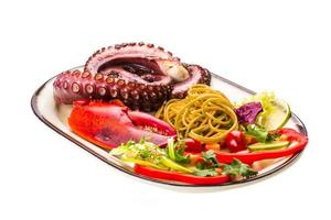 Seafood pasta with octopus and lobster leg photo