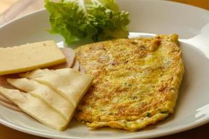 Omelet with cheese and salad photo