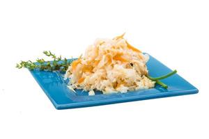 Fermented cabbage on white photo