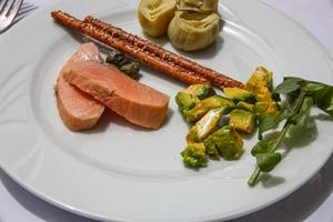 Salmon with avocado and artichoke photo