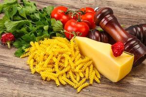 Raw Italian pasta Fusilli for cooking photo