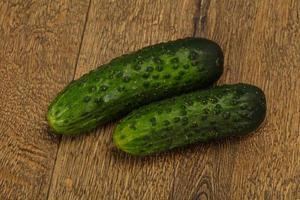 Ripe fresh green two cucumbers photo