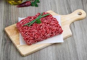Minced beef on cutting board photo