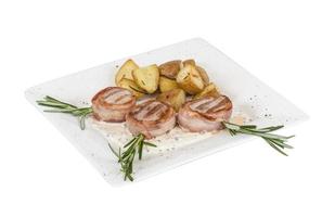 Grilled steak wrapped in bacon, with grilled vegetables, mashed potatoes photo