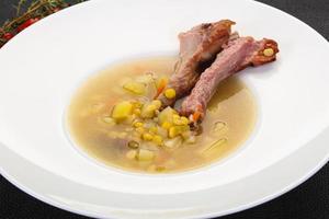 Peas soup with ribs photo