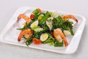 Salad with prawn, rocket and eggs photo