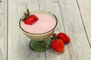 Yoghurt with strawberry in the bowl photo