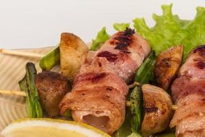 Bacon wrapped grilled Scallops with mushrooms and bacon photo