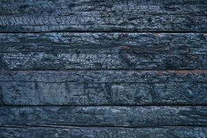 Flat surface charred wood wall background. photo