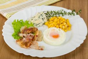 Breakfast with egg and bacon photo