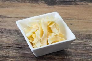 Coconut dry chips in the bowl photo