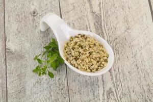 Peeled hemp seeds in the bowl photo
