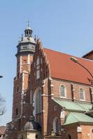 Cracow - Corpus Christi Church was founded by Kasimirus III The Great about 1340. The front elevation has a gothic gable whilst decoration of the interior is baroque photo